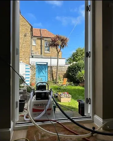 Hoses run neatly through the back door