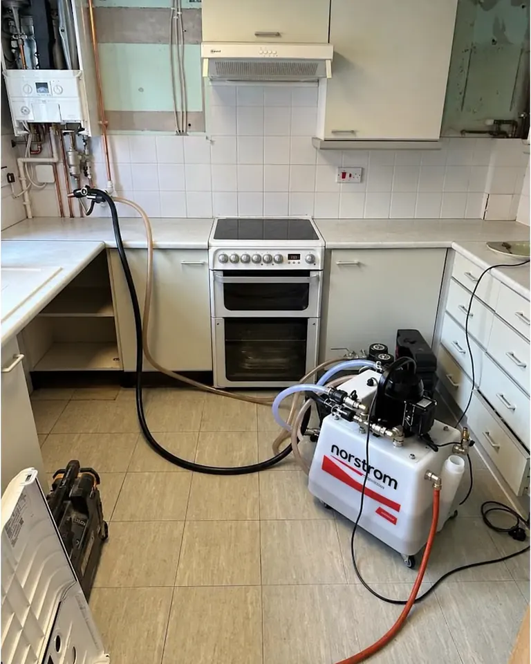 Powerflush machine at work in a kitchen